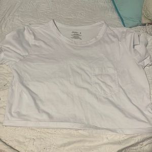 woman’s small white crop top